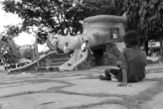 Children playing in the park in the town centre | Another personal favourite. It shows the socio-economic status in the Philippines.